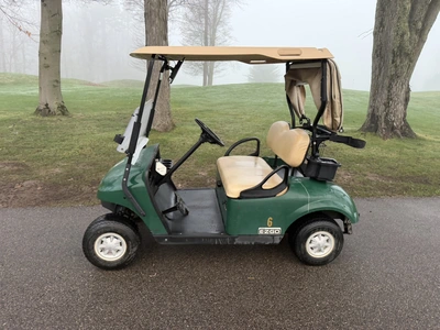 (1) 2015 E-Z-Go golf cart with a Kawasaki gas engine, includes canopy, ball cover, club cover, fold-...