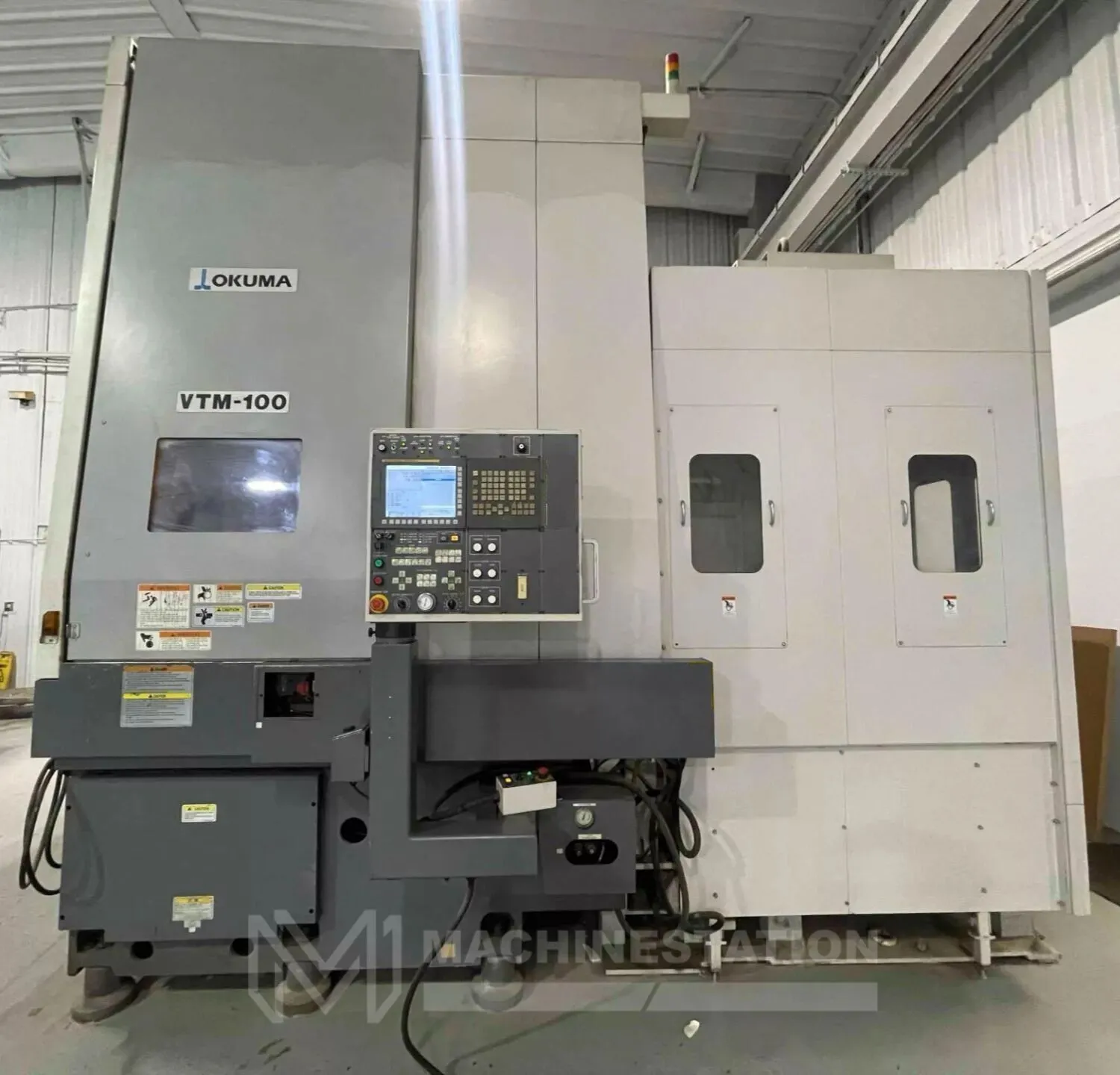 USED 2011 OKUMA VTM-100