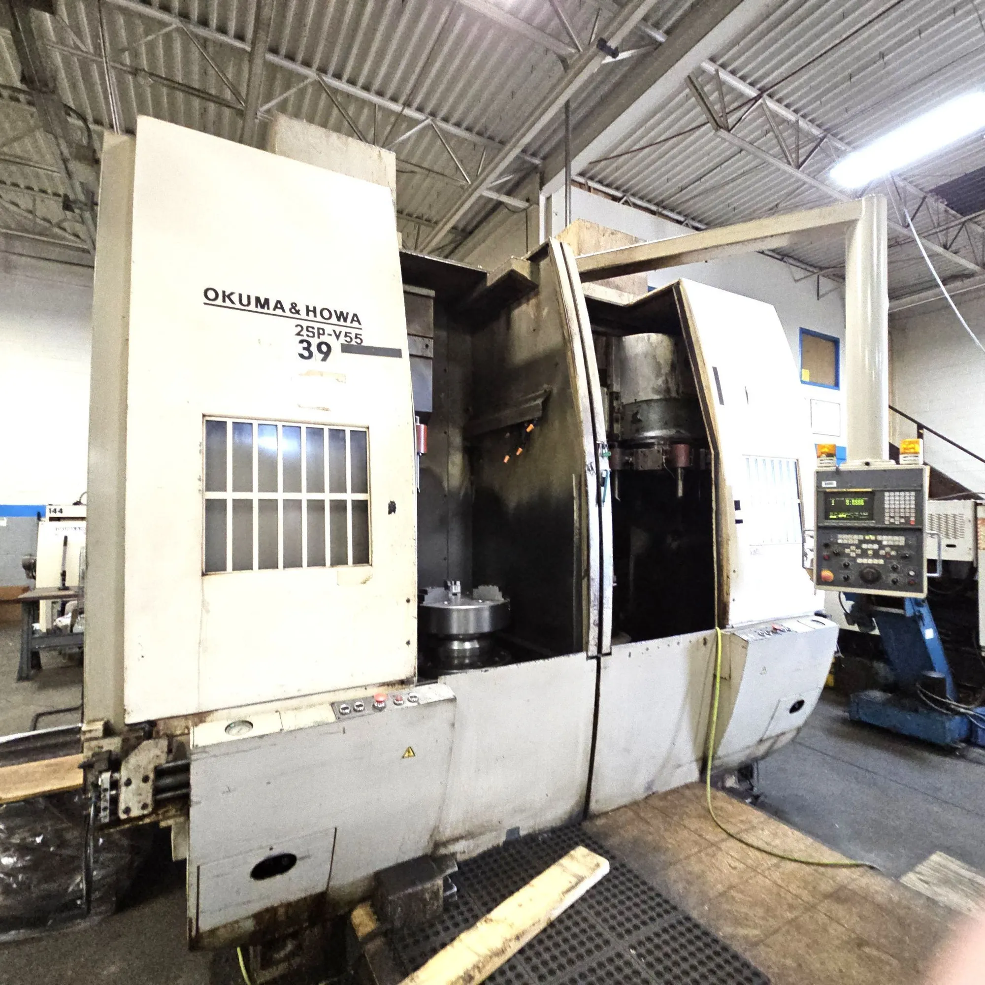2000 Okuma & Howa 2SP-V55 Twin Spindle Vertical Turning Center in Very Good Condition, (1) Kitagawa 21" 3- Jaw Solid Chuck (1) Kitagawa 15" 3-Jaw Chuck Installed Machine