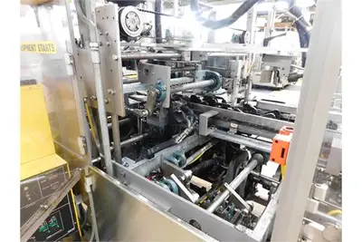 Douglas case packer with controls and magazine