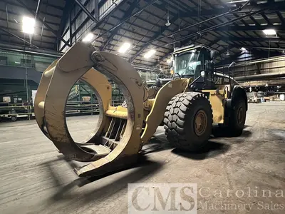 USED 2013 CAT 980K WHEEL LOADER WITH LOG FORKS