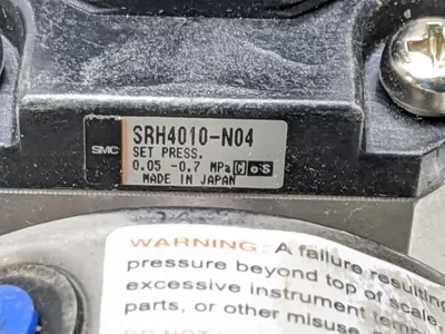 SRH4010-N04 | SMC  SS Regulator w/ Ashcroft 30 psi Liquid Filled Gauge - Used