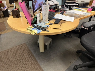 (1) L-shaped wooden desk, approx. 84" x 118" with dual monitor holders, does not include contents, d...