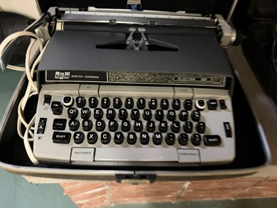 (1) SCM Smith Corona Electra 120 typewriter with case.