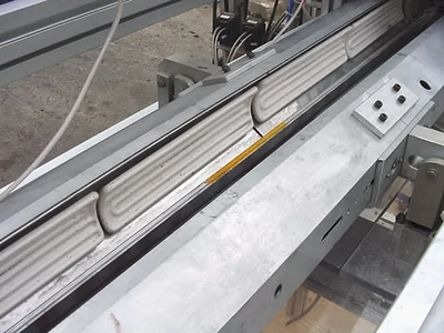 USED FOUR PISTON  HEATED HOT POUR FILLER 4 PISTON HOT POUR