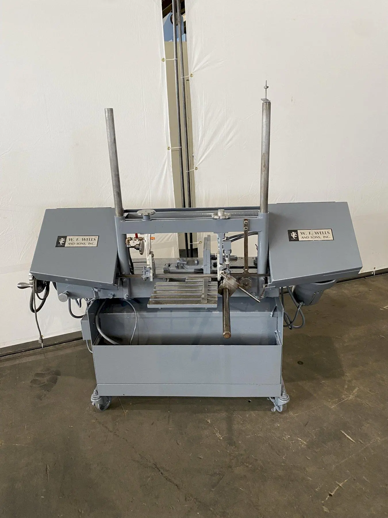 9" x 18" W. F. WELLS HORIZONTAL BANDSAW w/ DUAL COLUMNS. STOCK #0741422.