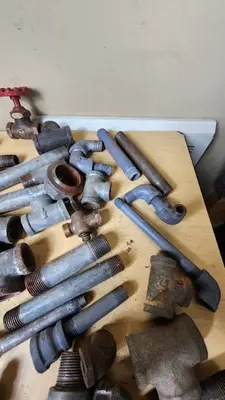 Lot of Plumbing Hardware and Fittings including Galvanized Nipples, Elbows, Valves, and Connectors