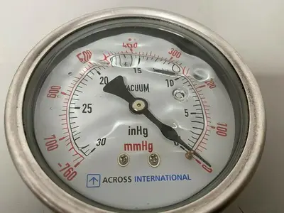 USED ACROSS INTERNATIONAL STAINLESS STEEL VACUUM GAUGE W/ 1/2" CONNECTION