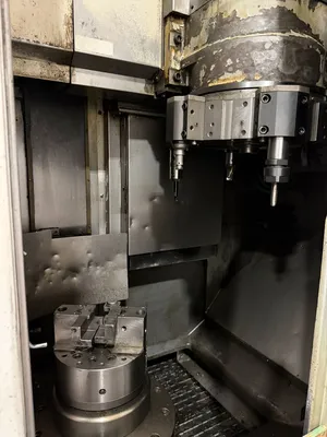 USED 2012 OKUMA 2SP-V40