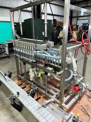 USED APEX FILLING SYSTEMS POF-12 12 SPOUT PRESSURE LIQUID FILLER