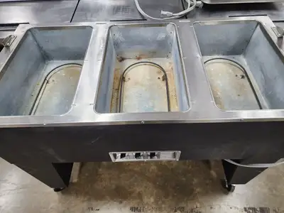 Used SuperMetal Used SuperMetal 3 Pan Open Well Heated Buffet Hot Food Steam Table with Open Base 208V Steam Tables (Food) Illinois US | Falcon Restaurant Supply #1376677
