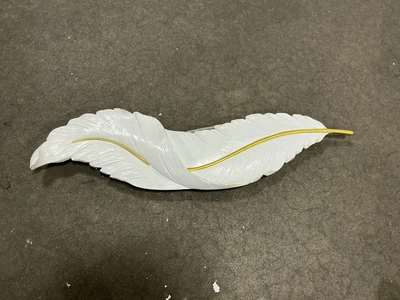 White and gold feather wall sconce