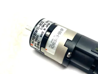 USED SMC DOUBLE ACTING 10MM ROTARY VANE ACTUATOR  W/ AUTO SWITCHES