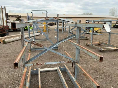 Metal Two Sided Cantilever Rack, on wheels so it can roll sideways (wheels are missing outer coating...