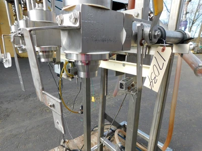 USED FOUR STATION VOLUMETIRIC FILLER FOUR STATION
