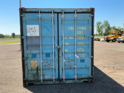 20’ Shipping / Storage Container 8’ wide x 8’ 6” tall, swing doors on one end, wood deck, rings for ...