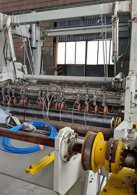 USED 2001 TOSCHI TWO DRUM TISSUE SLITTER REWINDER
