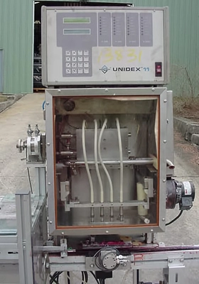 USED FOUR PISTON  HEATED HOT POUR FILLER 4 PISTON HOT POUR