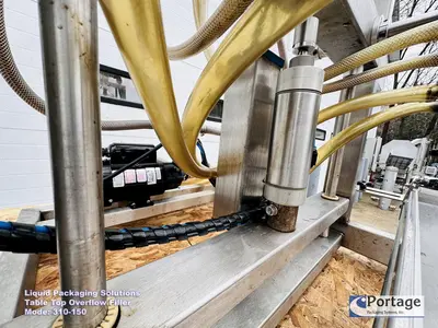 USED 2010 LIQUID PACKAGING 310-150 TT OVERFLOW FILLER