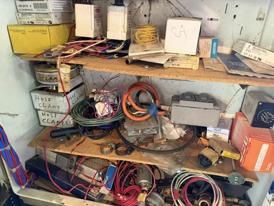 (1) control cabinet filled with assorted electrical items, includes screws, wire, terminals, hose cl...