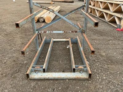 Metal Two Sided Cantilever Rack, on wheels so it can roll sideways (wheels are missing outer coating...