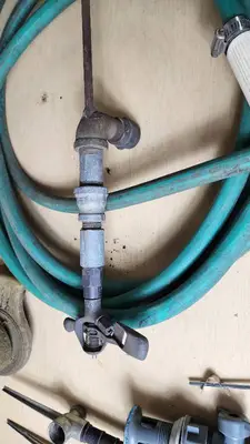 Garden Tools and Equipment including Weed Eater Grass Trimmer, Hose, and Accessories