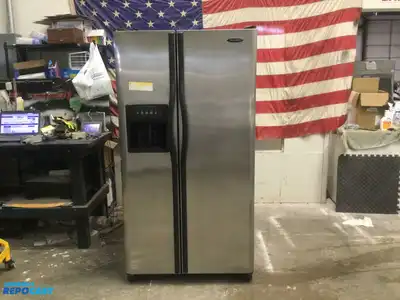 USED FRIGIDAIRE STAINLESS STEEL AND BLACK SIDE BY  SIDE REFRIDGERATOR HIGH EFFICANCY ENERGY STAR