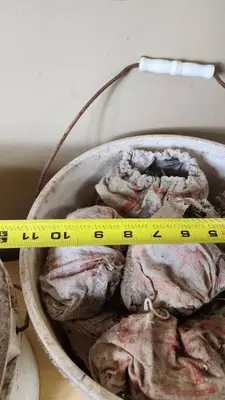 Buckets of Used Cast Iron Pipe Clamps with Bags