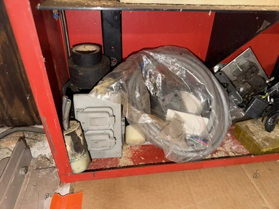 (2) Auto Call single door storage cabinets filled with assorted electrical items, including Push Mat...