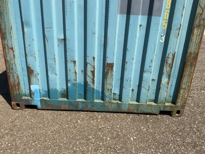 20’ Shipping / Storage Container 8’ wide x 8’ 6” tall, swing doors on one end, wood deck, rings for ...