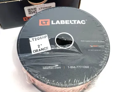 USED LABELTAC PRO MODEL HIGH PERF. 10 YEAR VINYL LABEL ORANGE, 2"X 150'/ ROLL