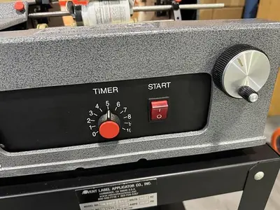 Advent model 310 semi-automatic pressure sensitive wraparound labeler