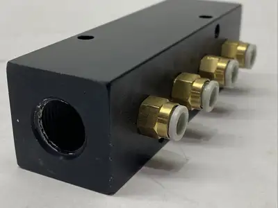PCM20-125-04B | Polyconn  Pneumatic Manifold 4x 1/8" NPT Out 3/8" NPT In - Used