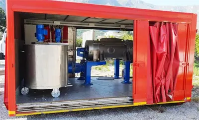 Pieralisi FP 600 RS decanter centrifuge in container.