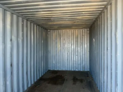 20’ Shipping / Storage Container 8’ wide x 8’ 6” tall, swing doors on one end, wood deck, rings for ...