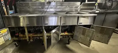 174-0002 Pitco SSH55 and SSHBN55 Battery of 4 Fryers with Middle Dump Station an