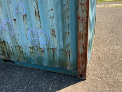 20’ Shipping / Storage Container 8’ wide x 8’ 6” tall, swing doors on one end, wood deck, rings for ...