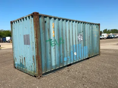 20’ Shipping / Storage Container 8’ wide x 8’ 6” tall, swing doors on one end, wood deck, rings for ...