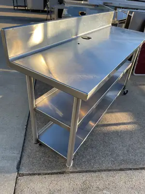 Used Falcon Restaurant Supply Used 60"x20" Heavy Stainless Table with Shelves, Casters and 6" Backsplash JD - SS323 Food Prep Tables Illinois US | Falcon Restaurant Supply #1375164