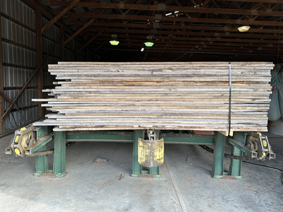 6 strand, 120' green chain with incoming deck and hoist. 24 heavy duty carts