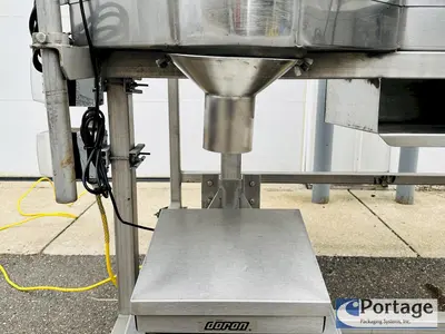 USED HEINZEN MANUFACTURING INTERNATIONAL 2720 MANUAL PACKING TABLE W/ DUAL SCALES