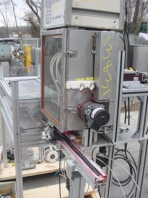 USED FOUR PISTON  HEATED HOT POUR FILLER 4 PISTON HOT POUR