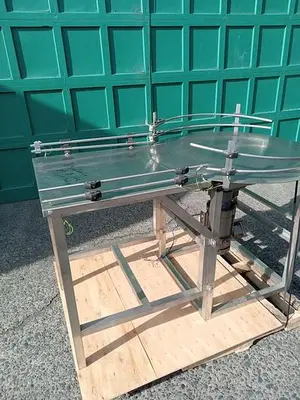 USED INLINE FILLING SYSTEMS 36" ROTARY DUMP/FEED TABLE (EXP. PROOF)