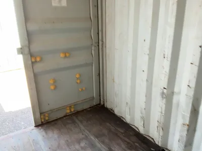 20’ Shipping / Storage Container 8’ wide x 8’ 6” tall, swing doors on one end, wood deck, rings for ...
