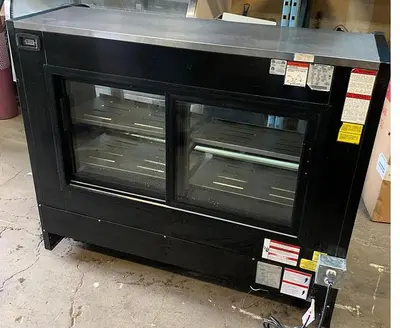 57" WIDE TOR REY CURVED GLASS SHOWCASE
