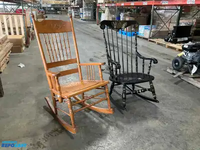Lot of (2) wooden rocking chairs- brown press back oak rocking chair & black Boston rocker...