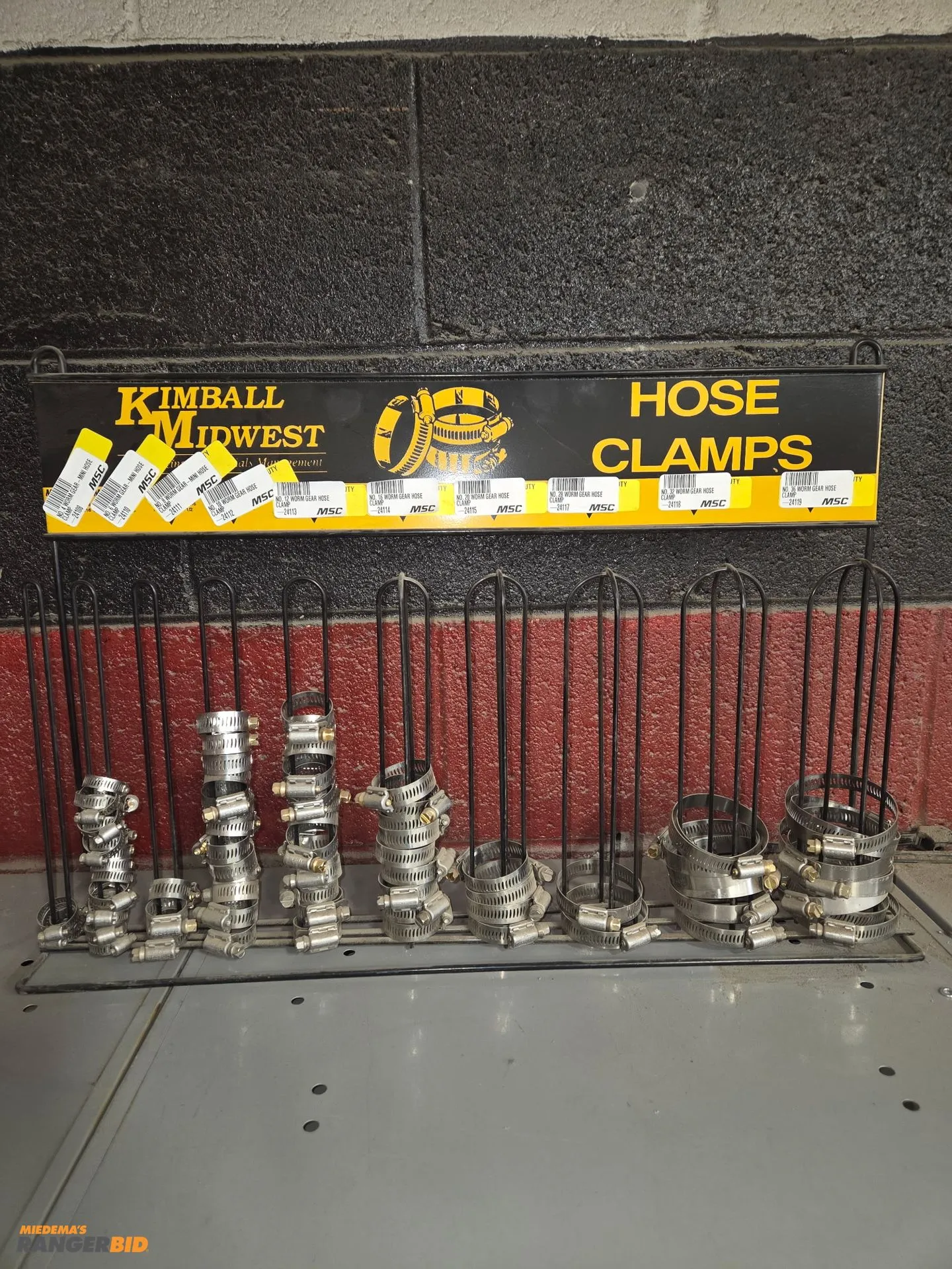 Hose clam rack, peg board with approximately 25 pegs, wire rack, rod rack with misc threaded rod.