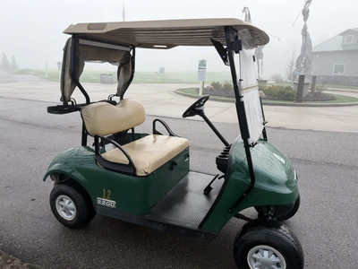 (1) 2015 E-Z-Go golf cart with a Kawasaki gas engine, includes canopy, ball cover, club cover, fold-...
