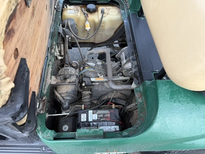 (1) 2015 E-Z-Go golf cart with a Kawasaki gas engine, includes canopy, ball cover, club cover, fold-...