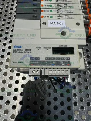 USED SMC EX140-SDN1 INTERFACE SERIAL UNIT W/ LOT OF 8 SMC SQ1A31Y-5-N7 SOLENOID VALVE